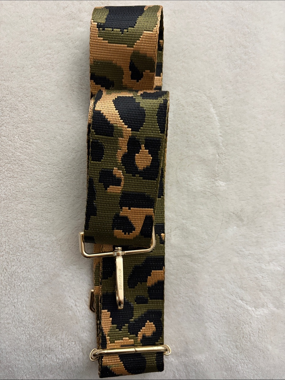 Ah-dorned bag strap